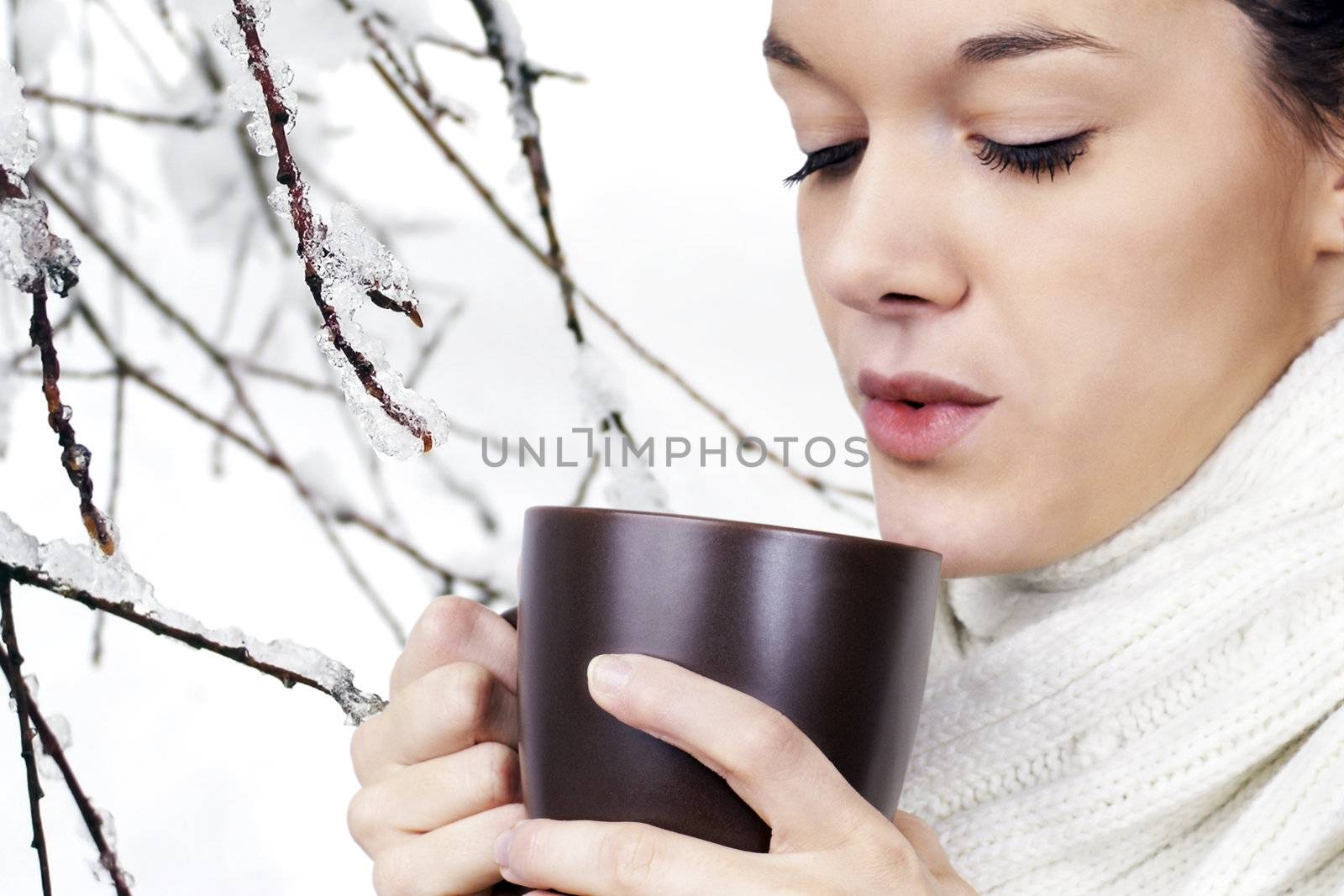 Young woman with hot beverage by Mirage3