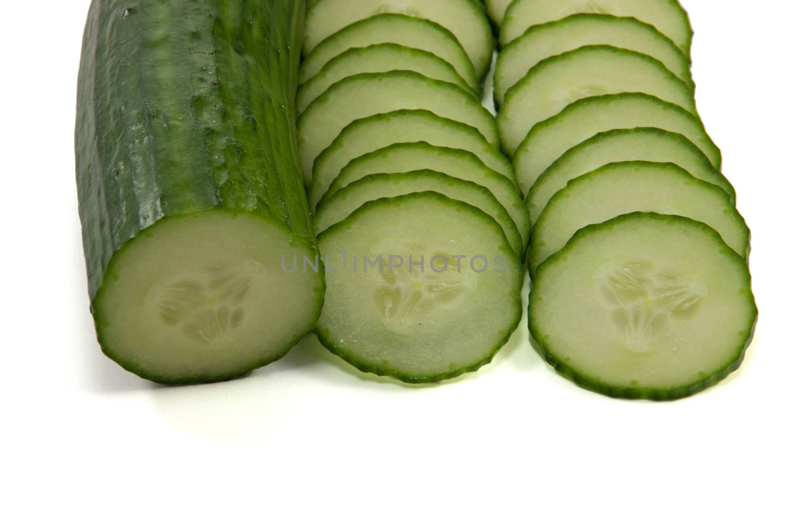 Picture of a half cucumber and some slices