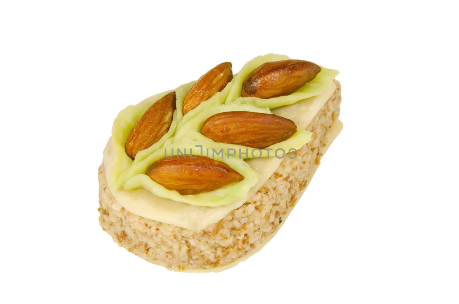 pastry ornamented with almonds isolated on a white background