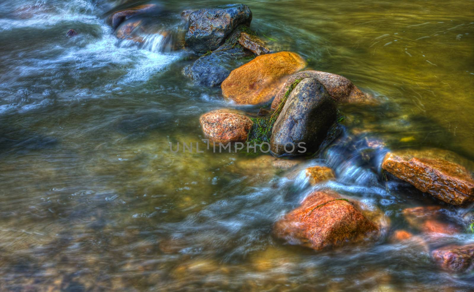 Rocks and rolling river in high dynamic range.