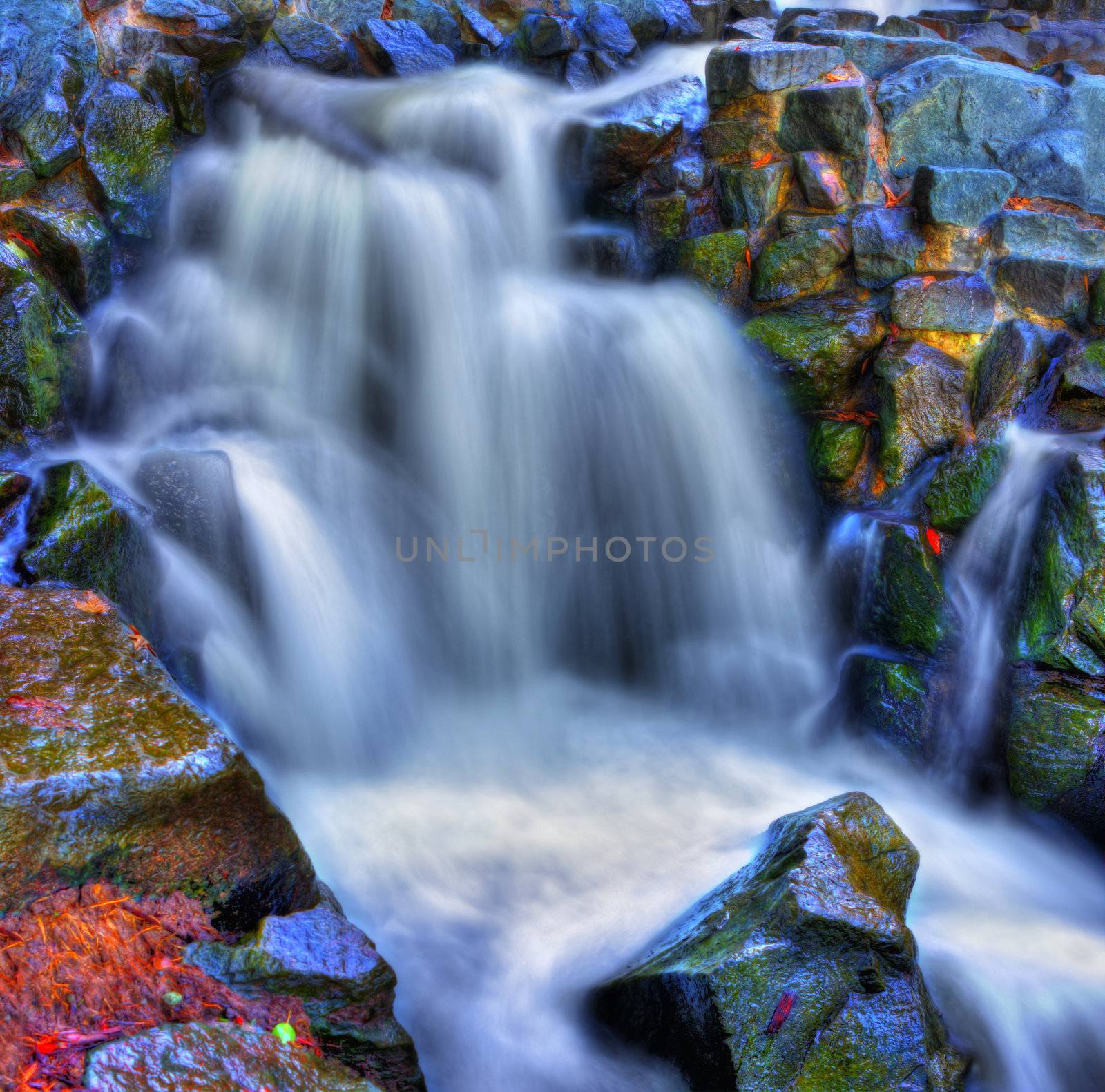 Colorful scenic river waterfall in HDR and slow shutter.