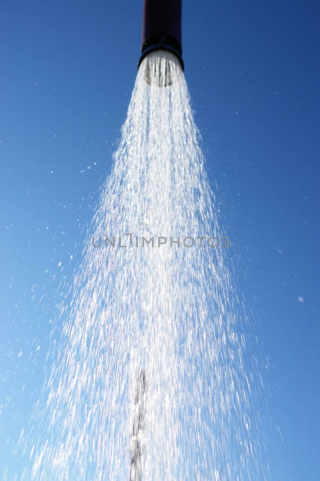 water drops falling from a shower outside