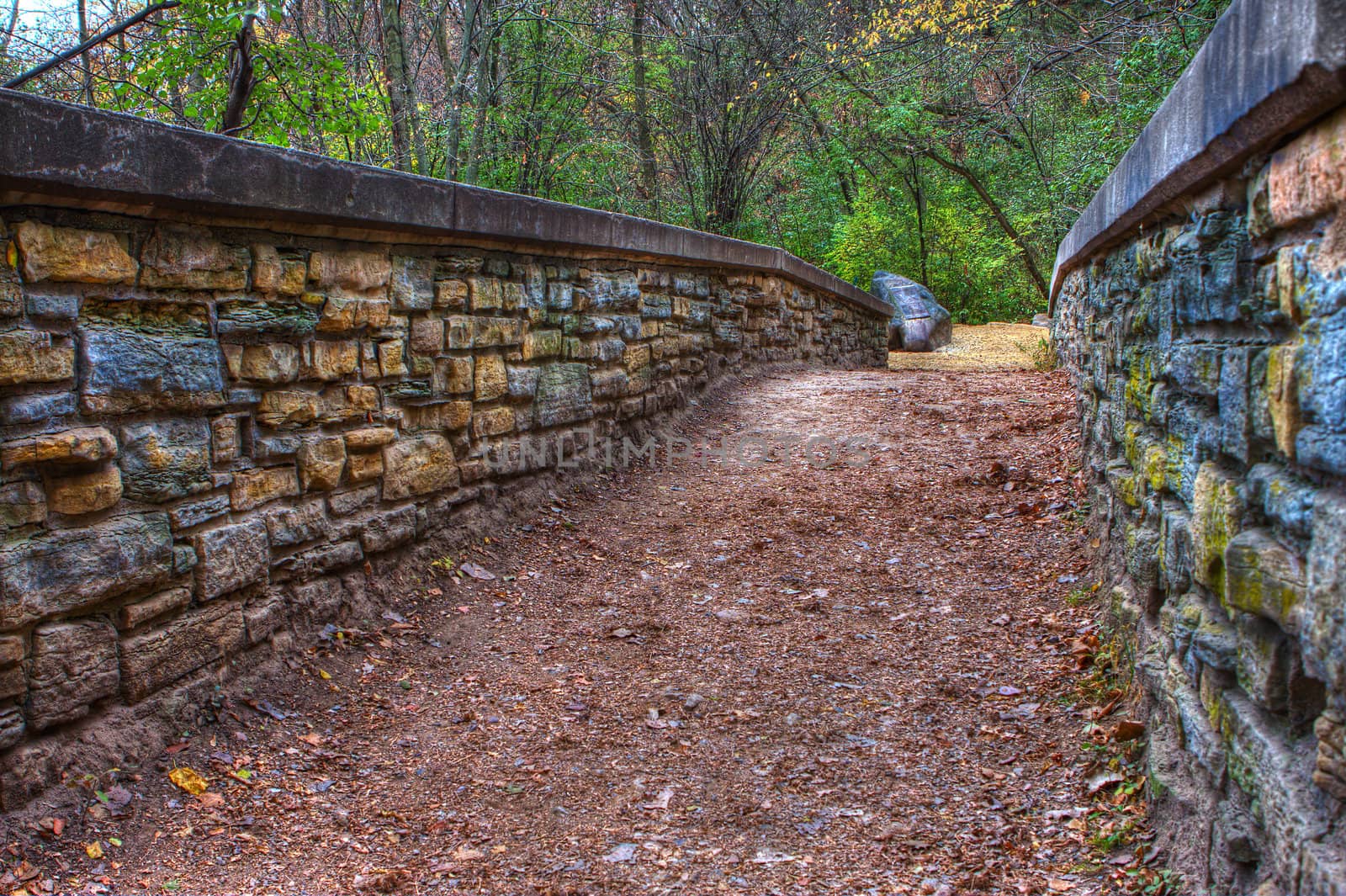 Small brick bridge in the forest in HDR.