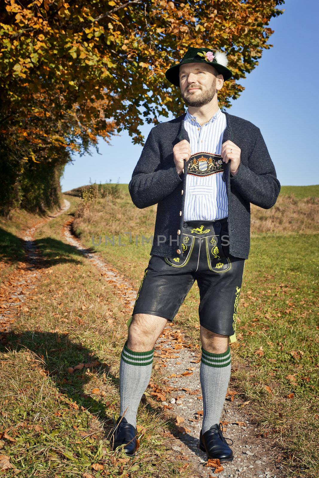 A traditional bavarian man in the autumn nature