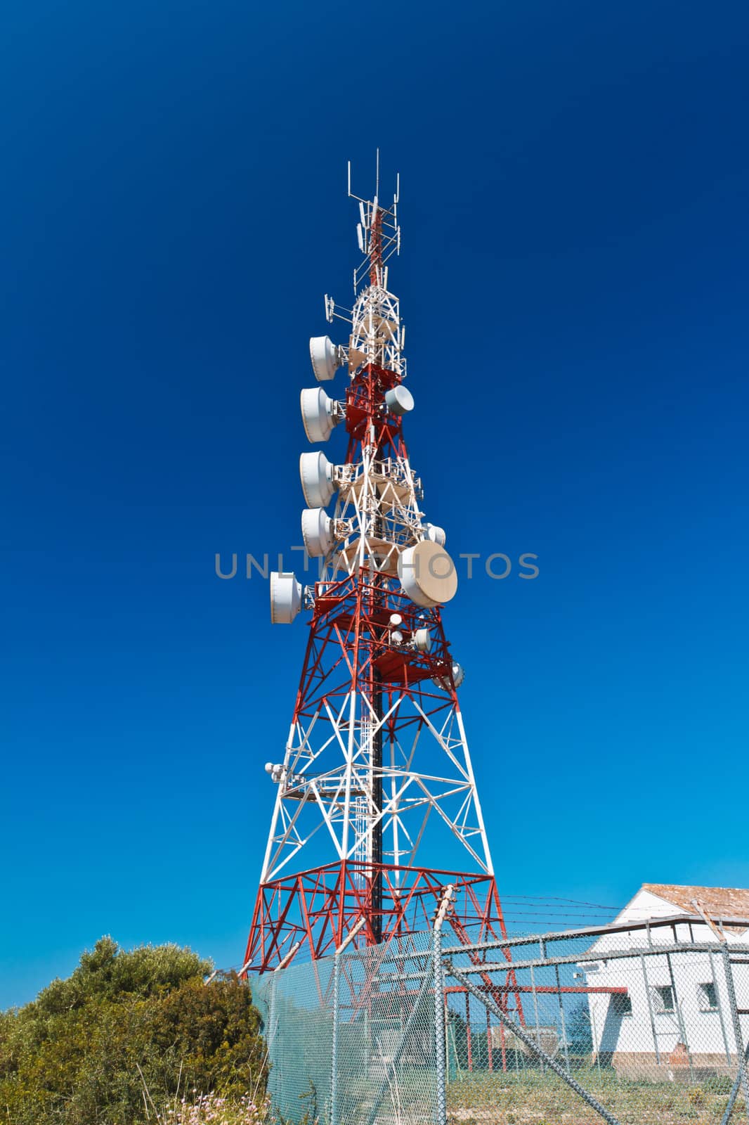 Communications tower with a beautiful blue sky