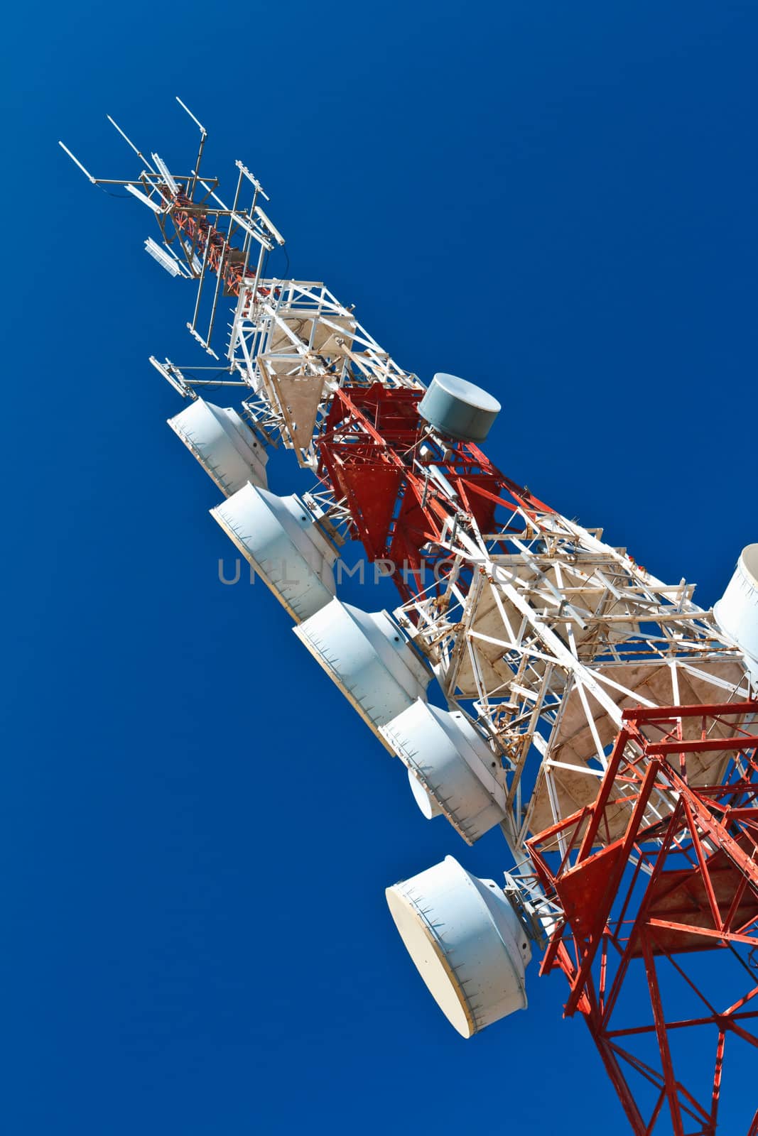 Communications tower with a beautiful blue sky