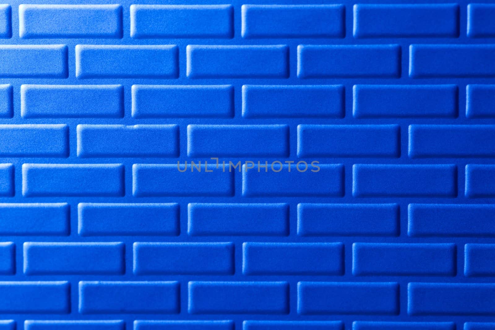 A wall formed by metal bricks