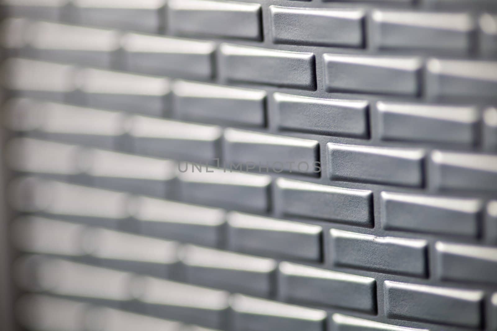 A wall formed by metal bricks