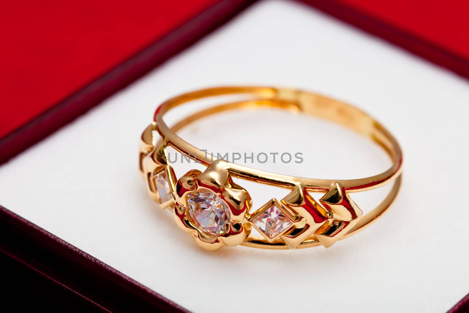 Fantastic gold ring adorned with several white zirconia
