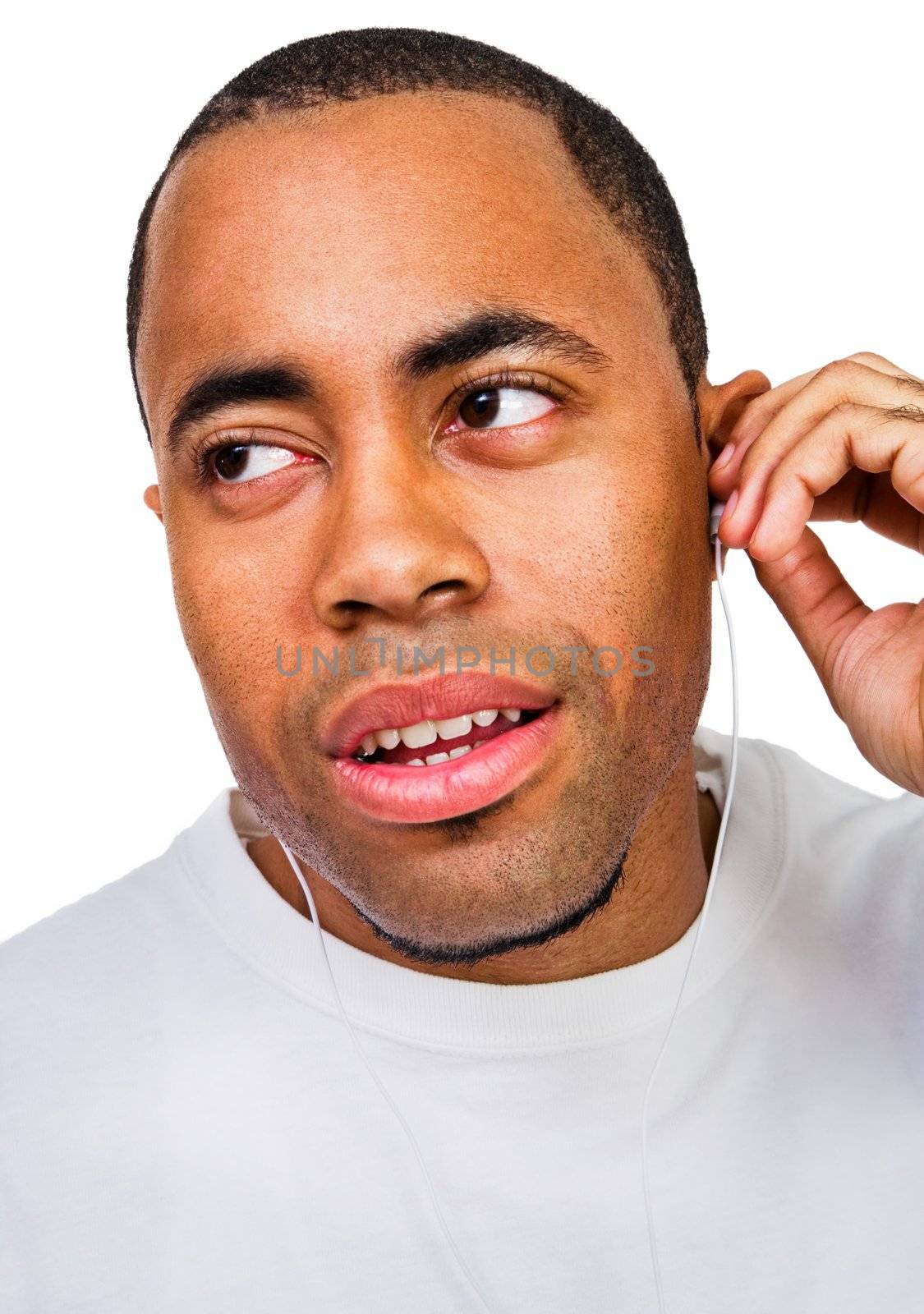 Man listening to music on a MP3 player isolated over white
