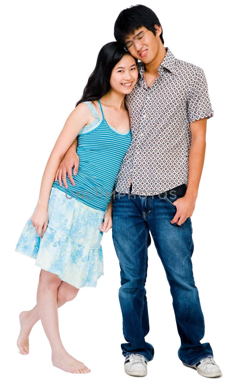 Portrait of a couple smiling and posing together isolated over white