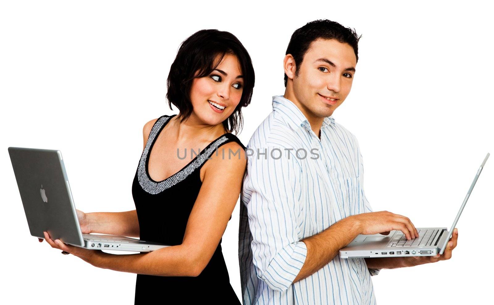 Portrait of a couple using laptops and smiling isolated over white