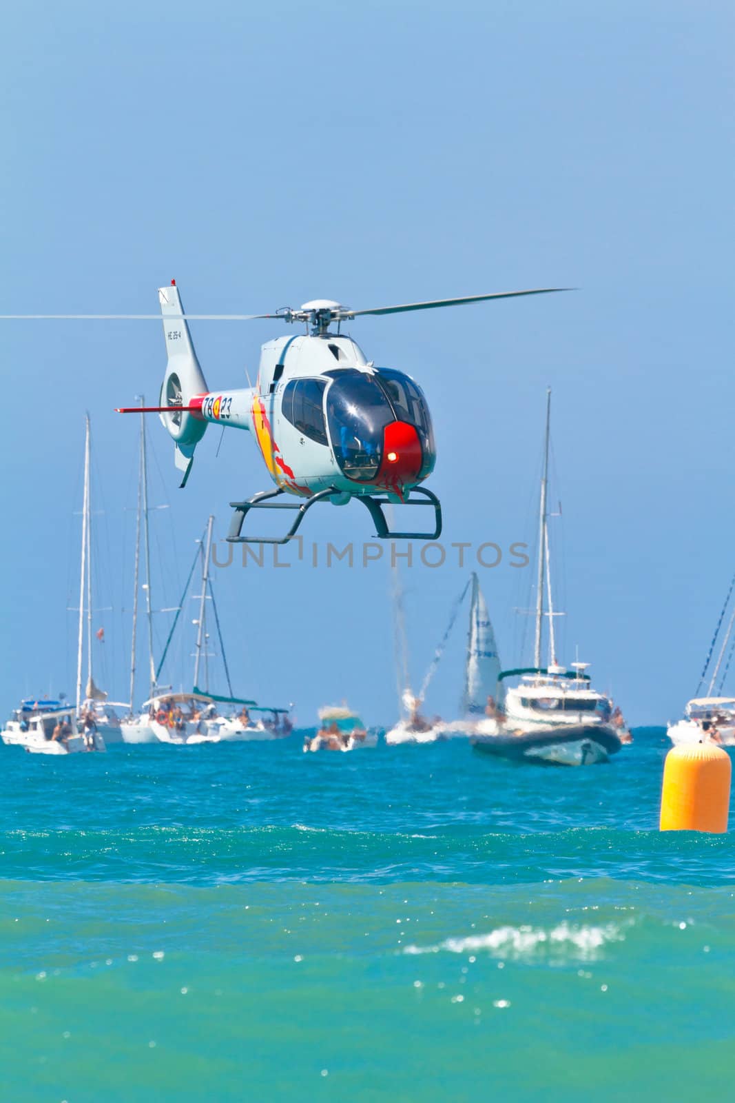 CADIZ, SPAIN-SEP 11: Helicopters of the Patrulla Aspa taking part in an exhibition on the 4th airshow of Cadiz on Sep 11, 2011, in Cadiz, Spain