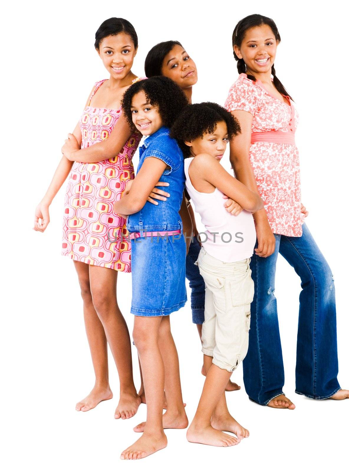 Girls standing with teenage girls and smiling isolated over white