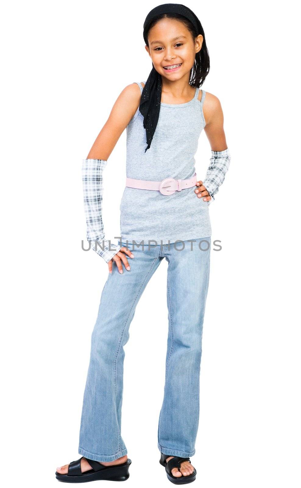 Girl standing with hand on hip isolated over white