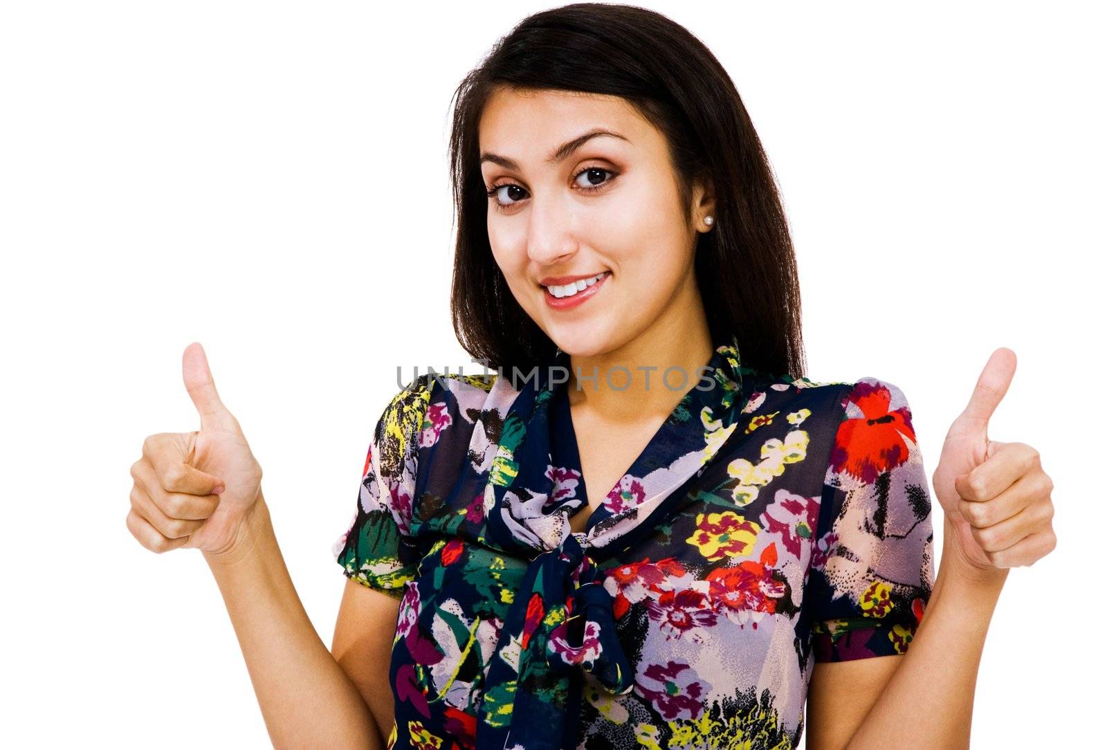 Confident woman showing thumbs-up sign and smiling isolated over white