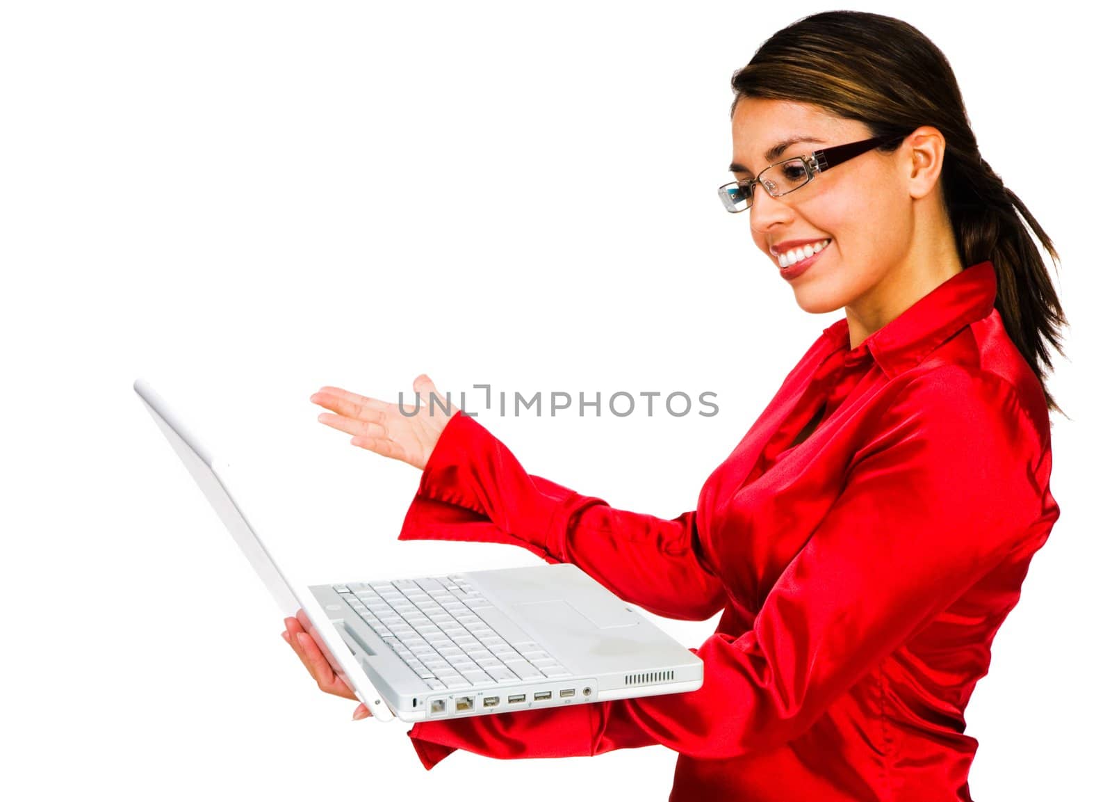 Latin American woman using a laptop and smiling isolated over white