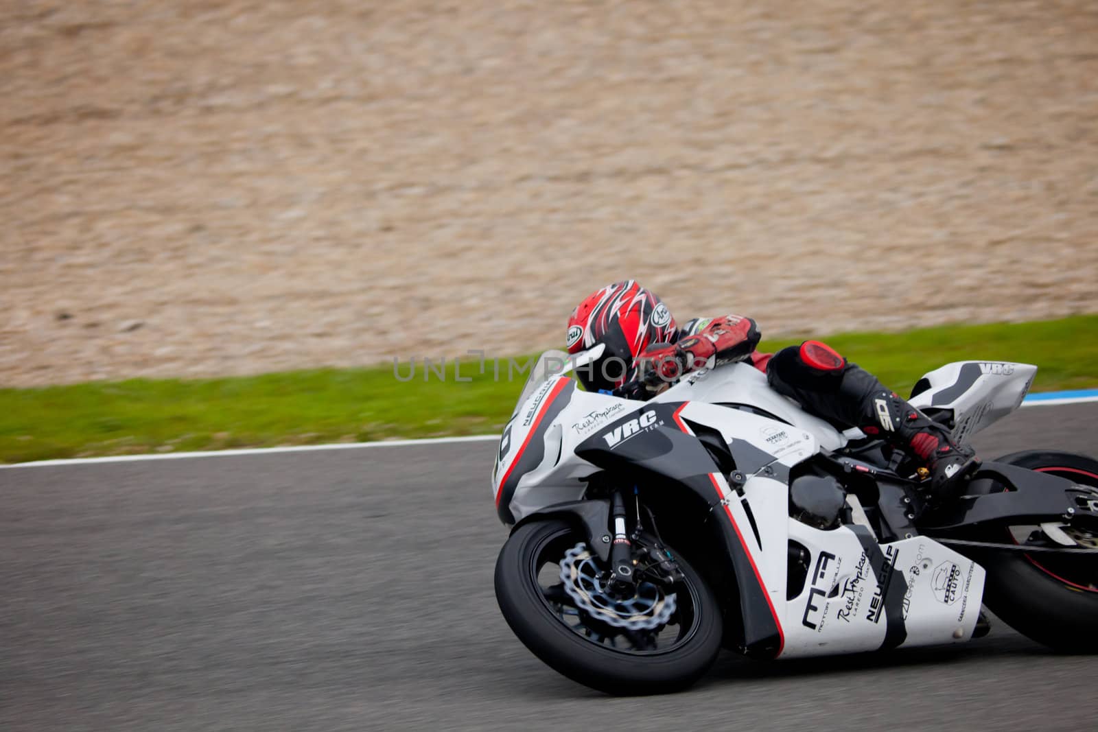 JEREZ DE LA FRONTERA, SPAIN - NOV 20: Stock Extreme motorcyclist Adrian Gandara takes a curve in the CEV championship on Nov 20, 2010, in Jerez de la Frontera, Spain