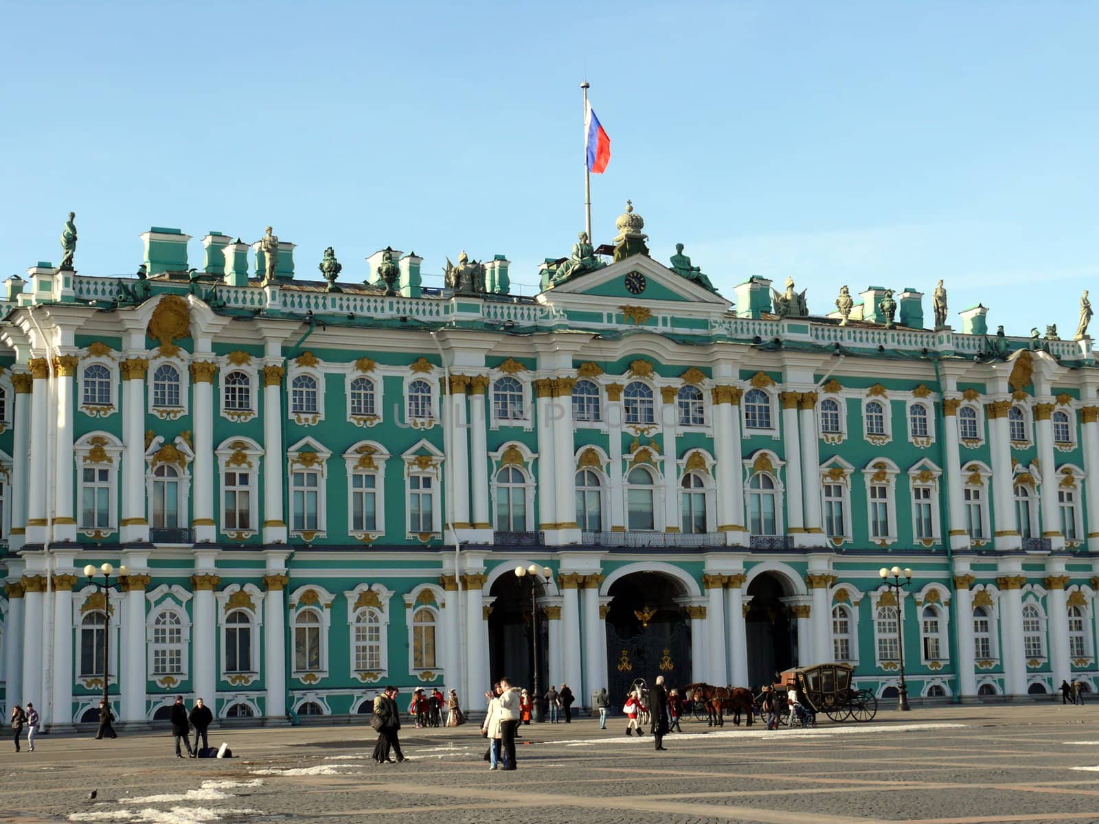 Saint-Petersburg, Russia - March 25, 2010: Peoples near the Hermitage in spring day on March 25, 2010 in Saint-Petersburg, Russia