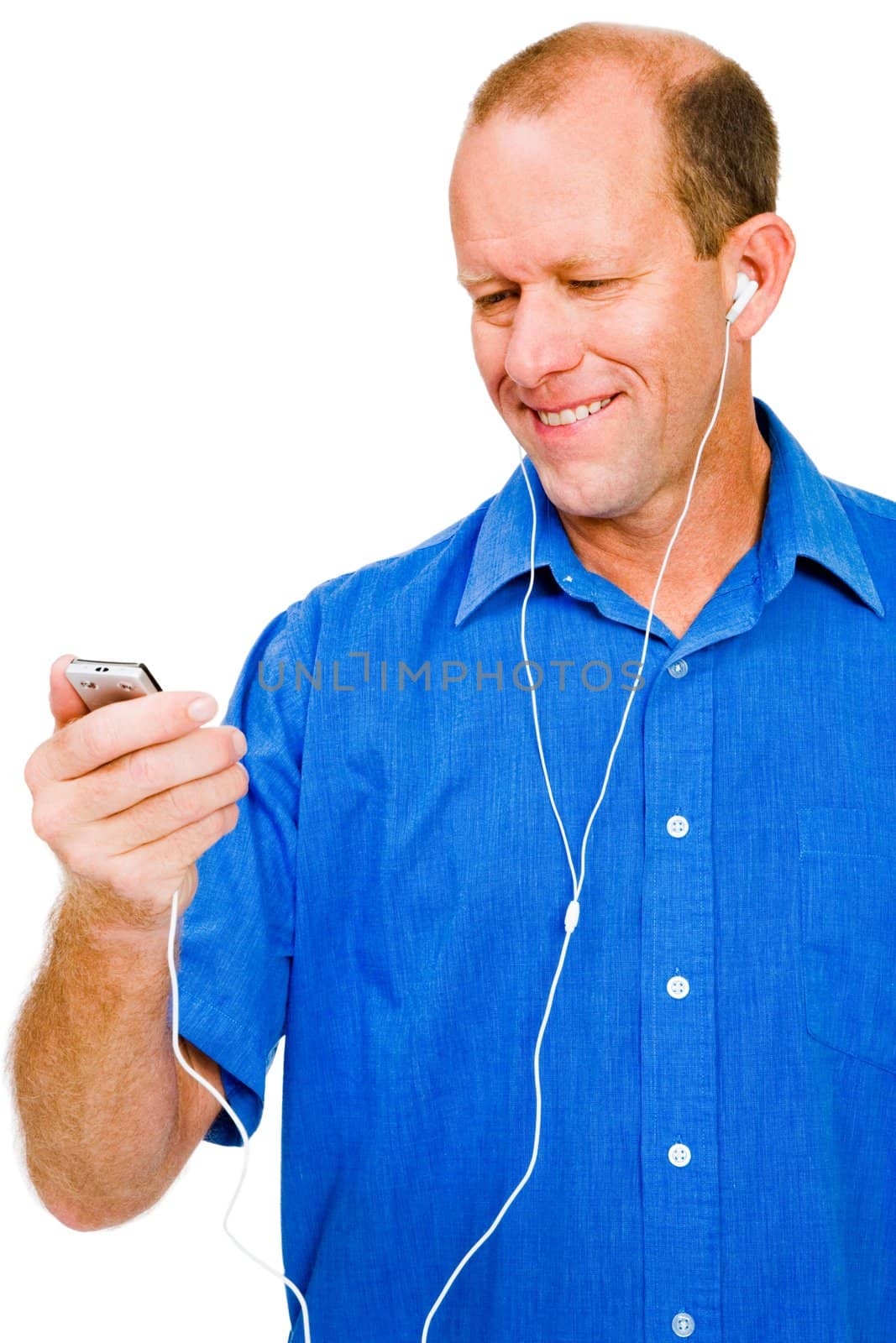 Close-up of a man listening to music on MP3 player isolated over white