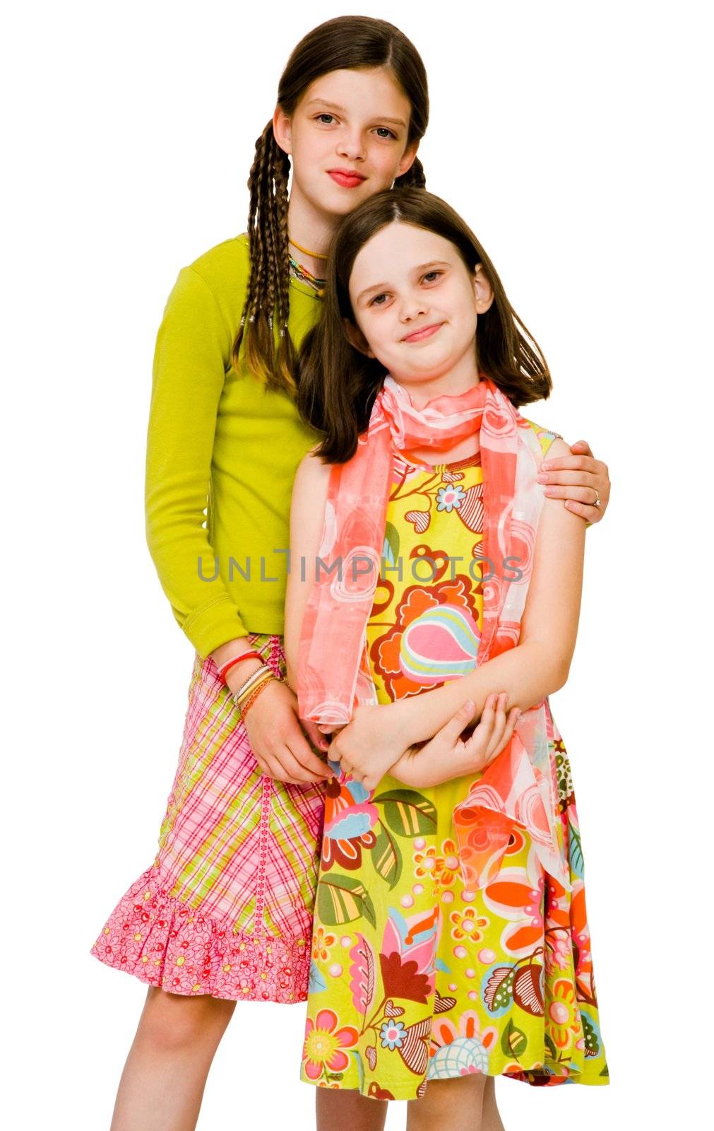 Two girls posing and smiling together isolated over white