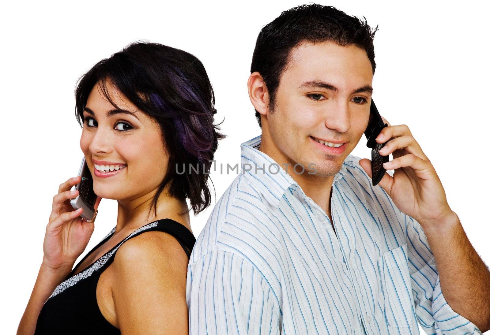 Happy couple talking on mobile phones isolated over white