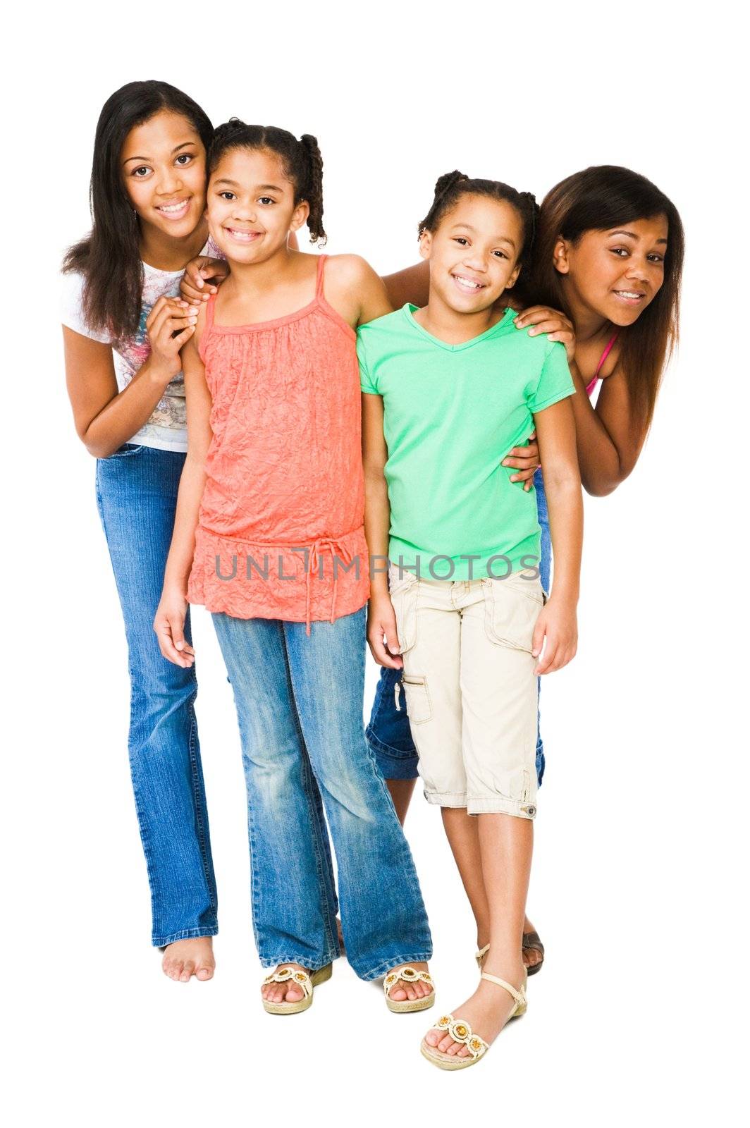 Portrait of happy friends standing together and smiling isolated over white