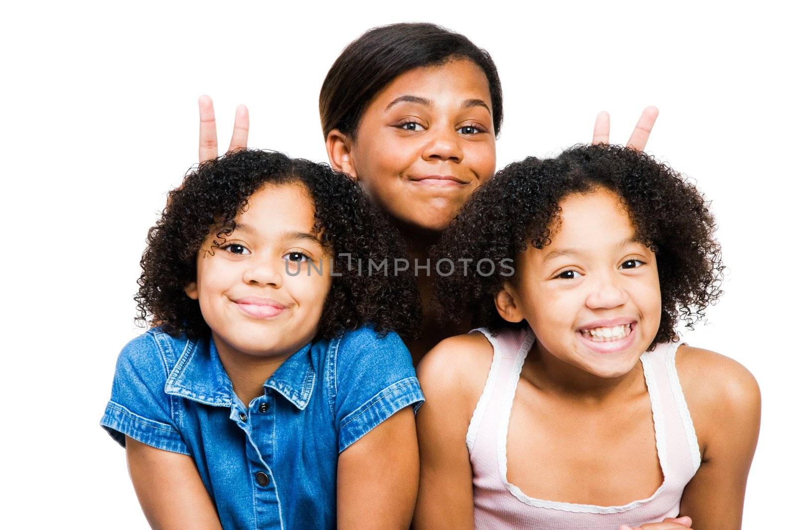 Three friends posing and smiling together isolated over white