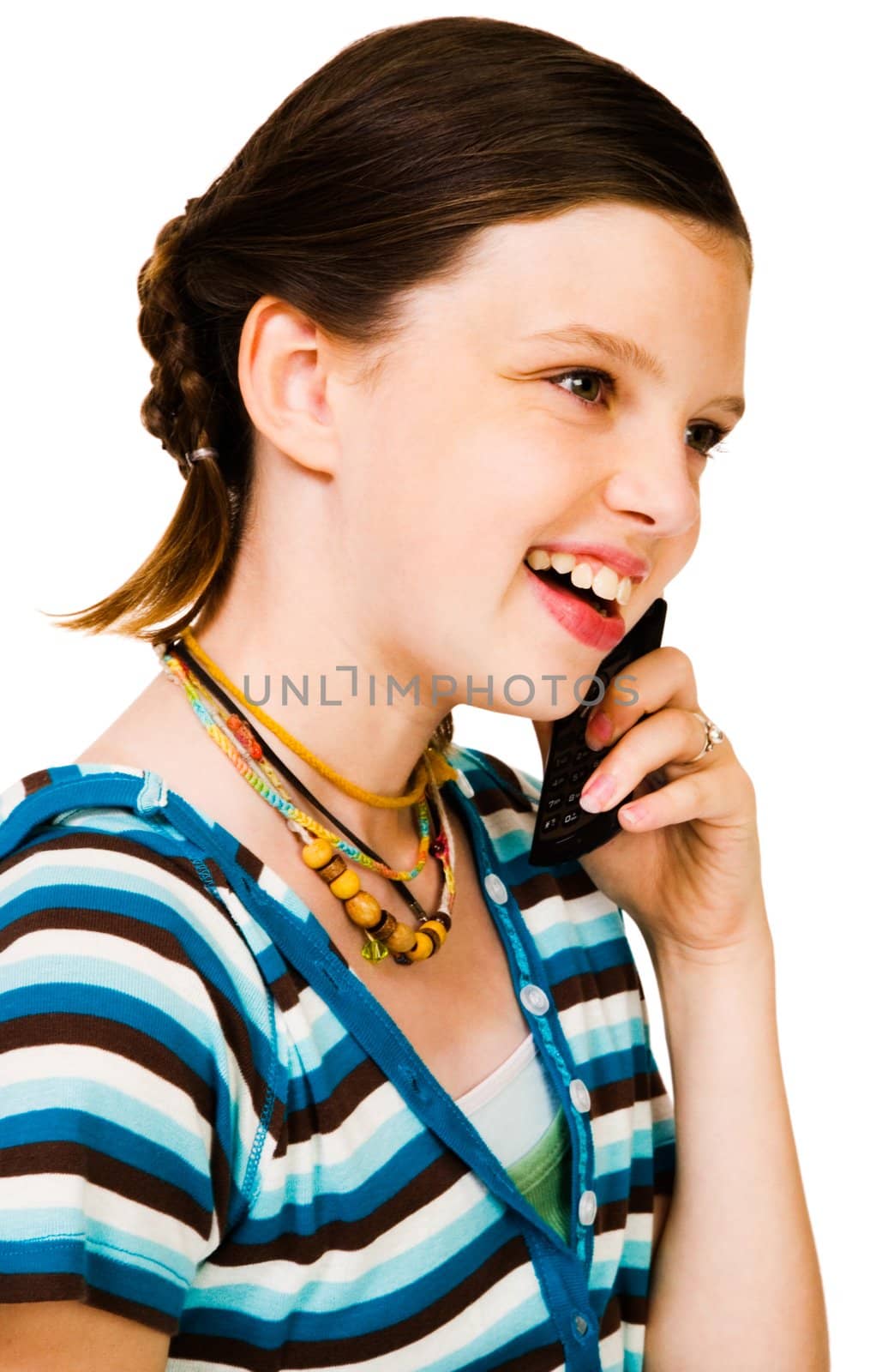Confident girl talking on a mobile phone and smiling isolated over white