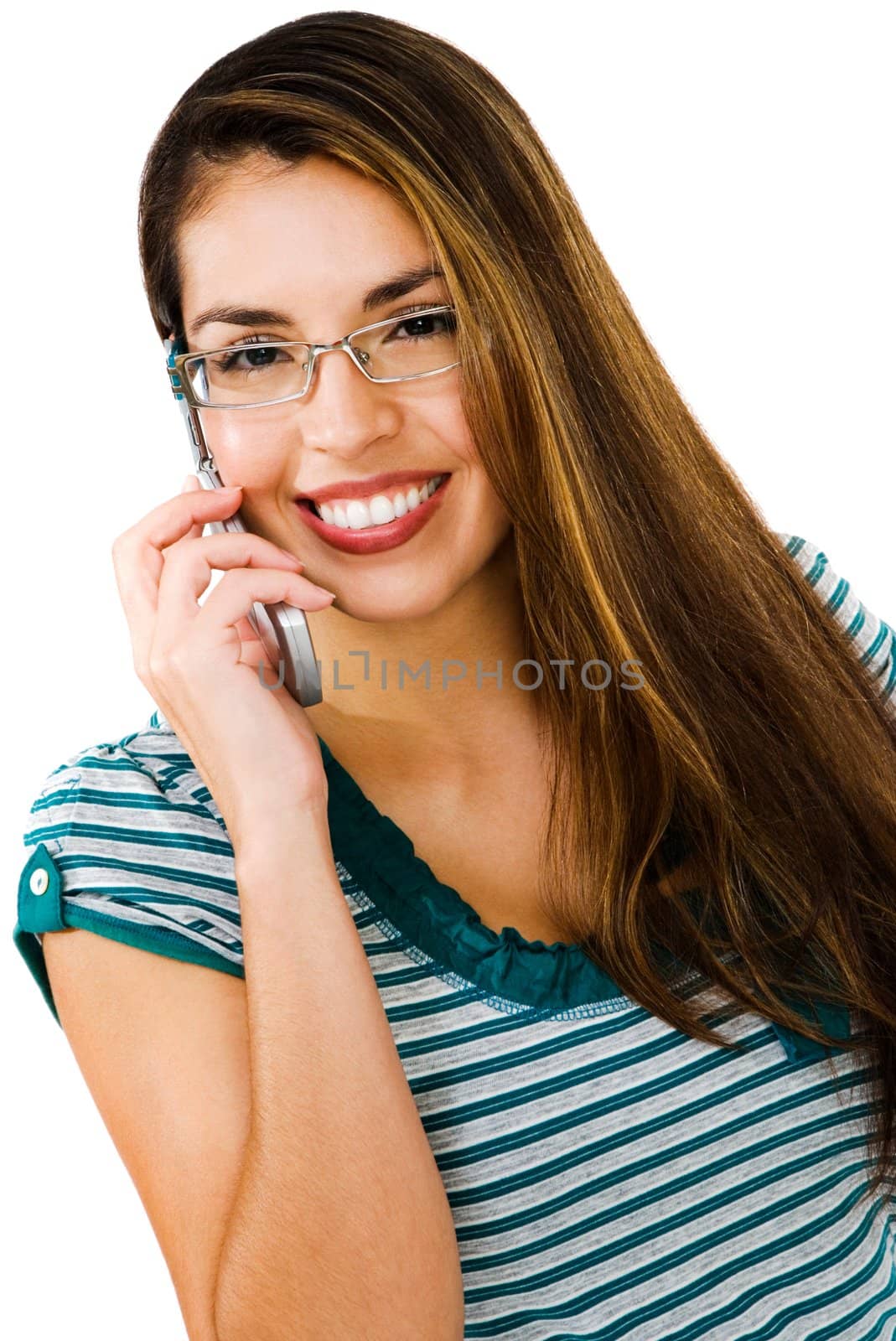 Latin American woman talking on a mobile phone isolated over white