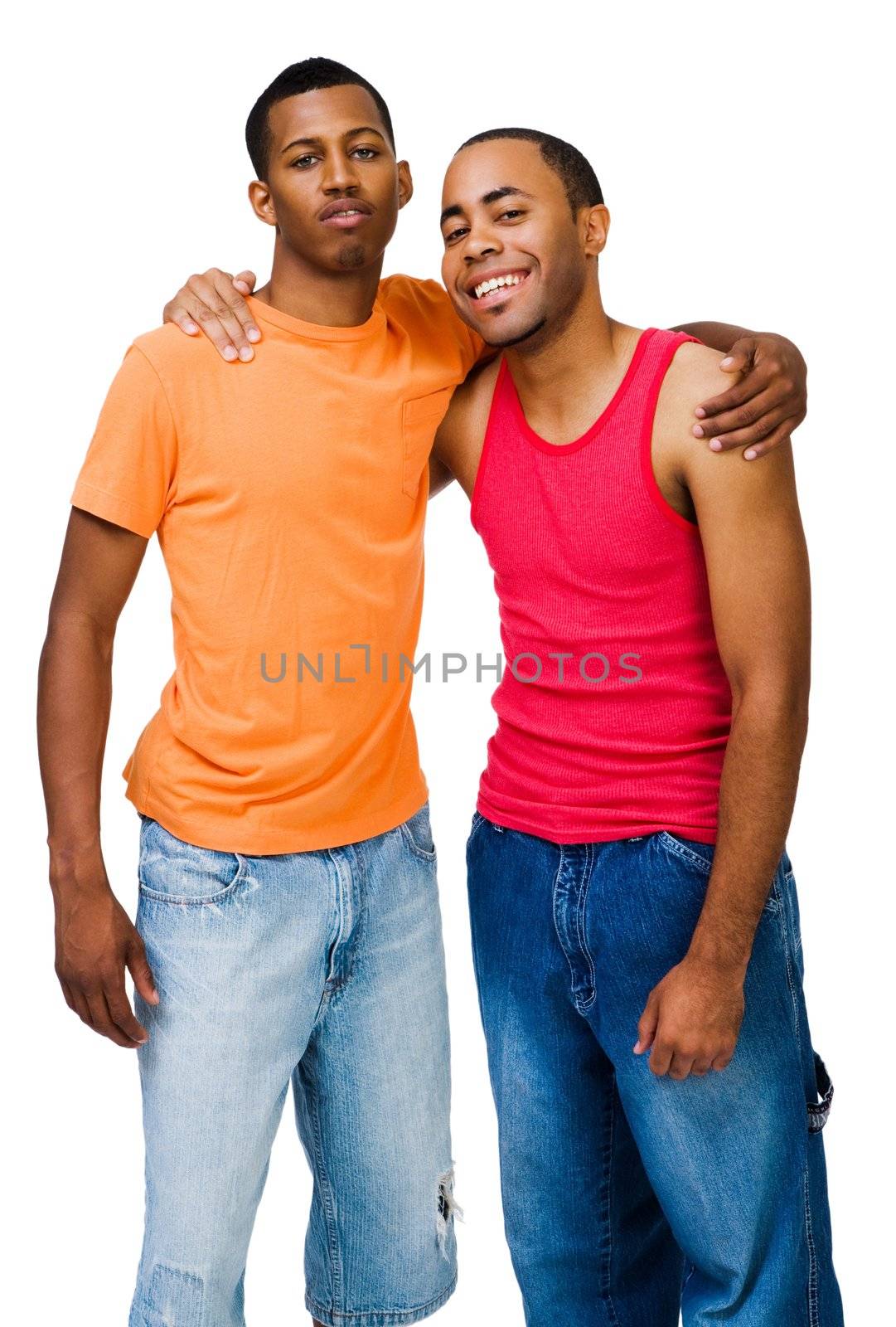 Portrait of two happy friends posing together isolated over white