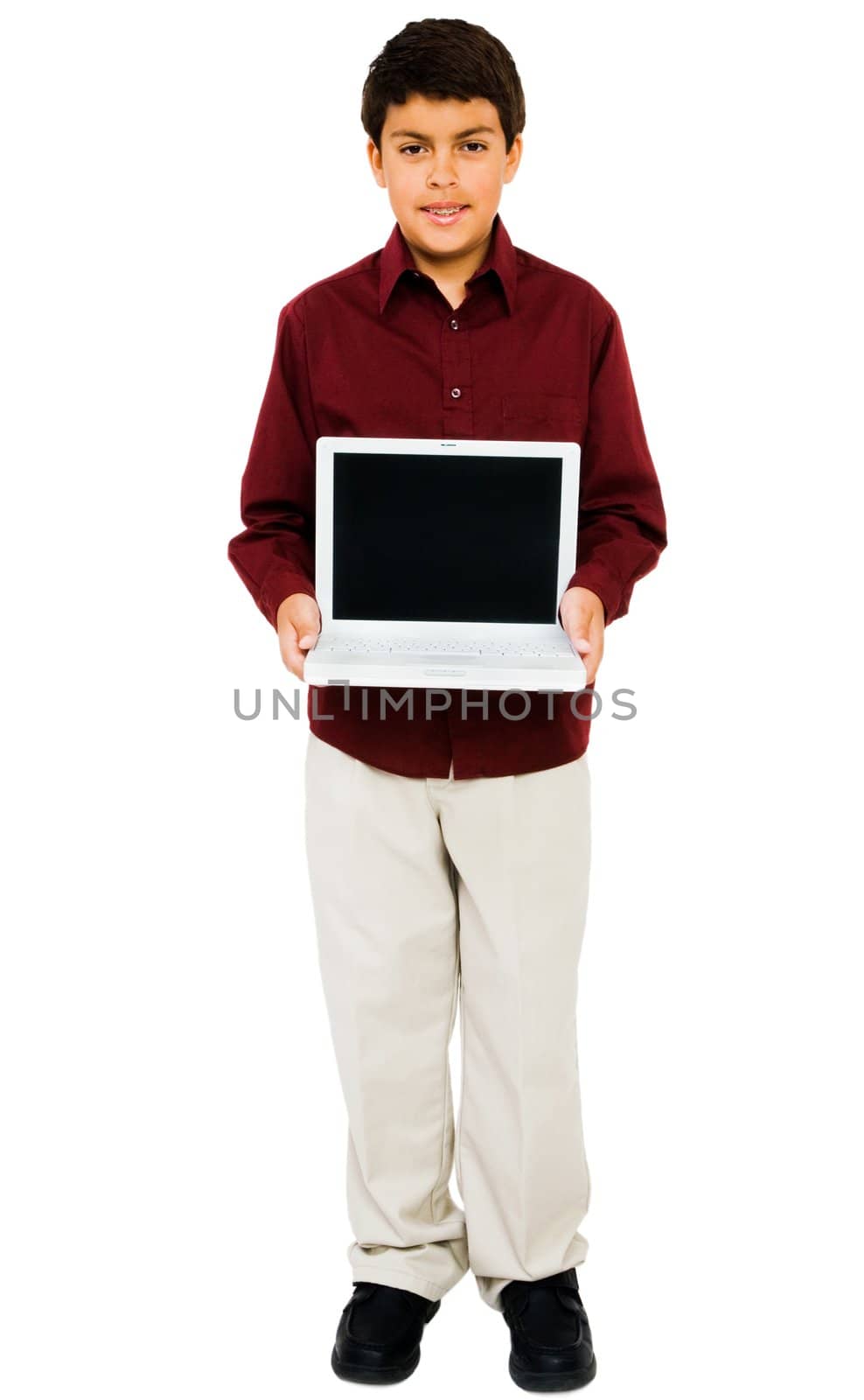 Boy showing a laptop isolated over white