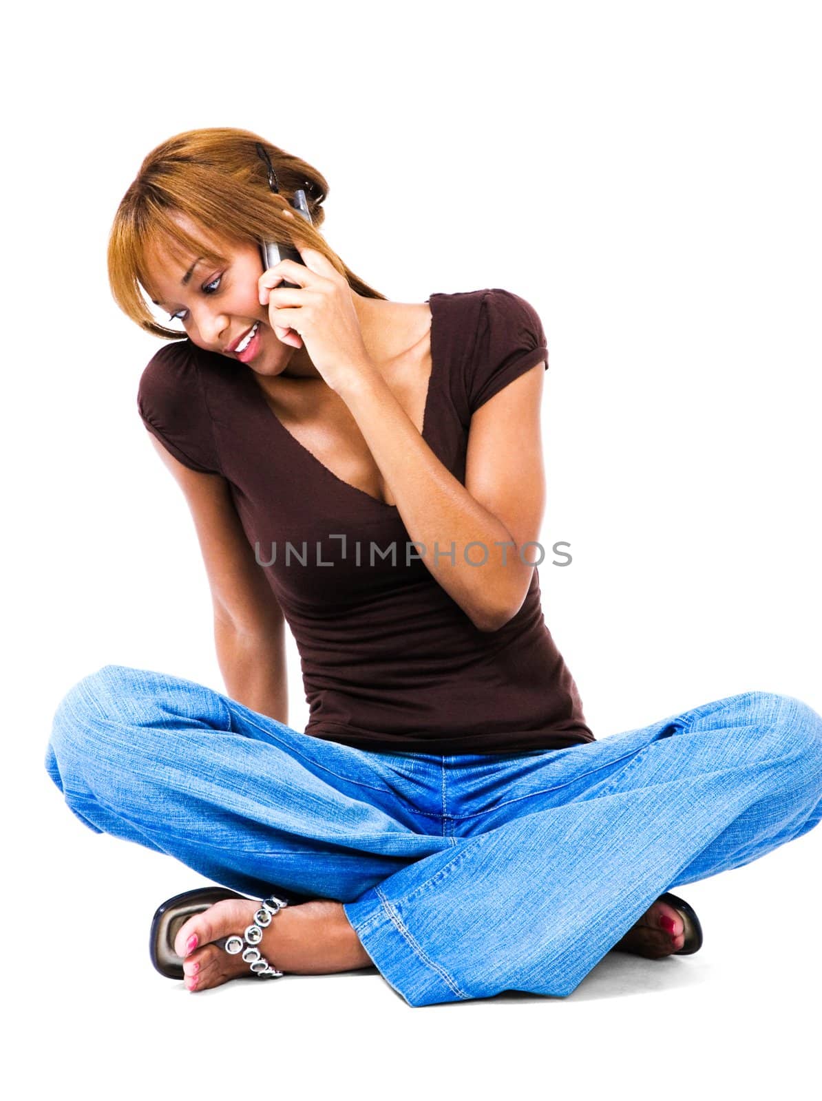 Happy woman talking on a mobile phone isolated over white
