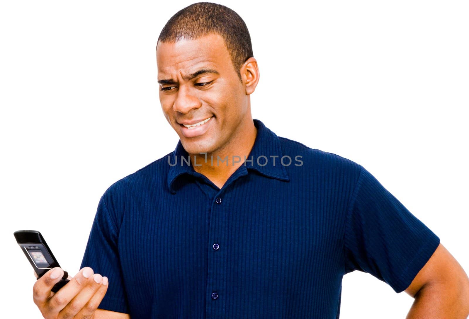 Smiling man text messaging on a mobile phone isolated over white