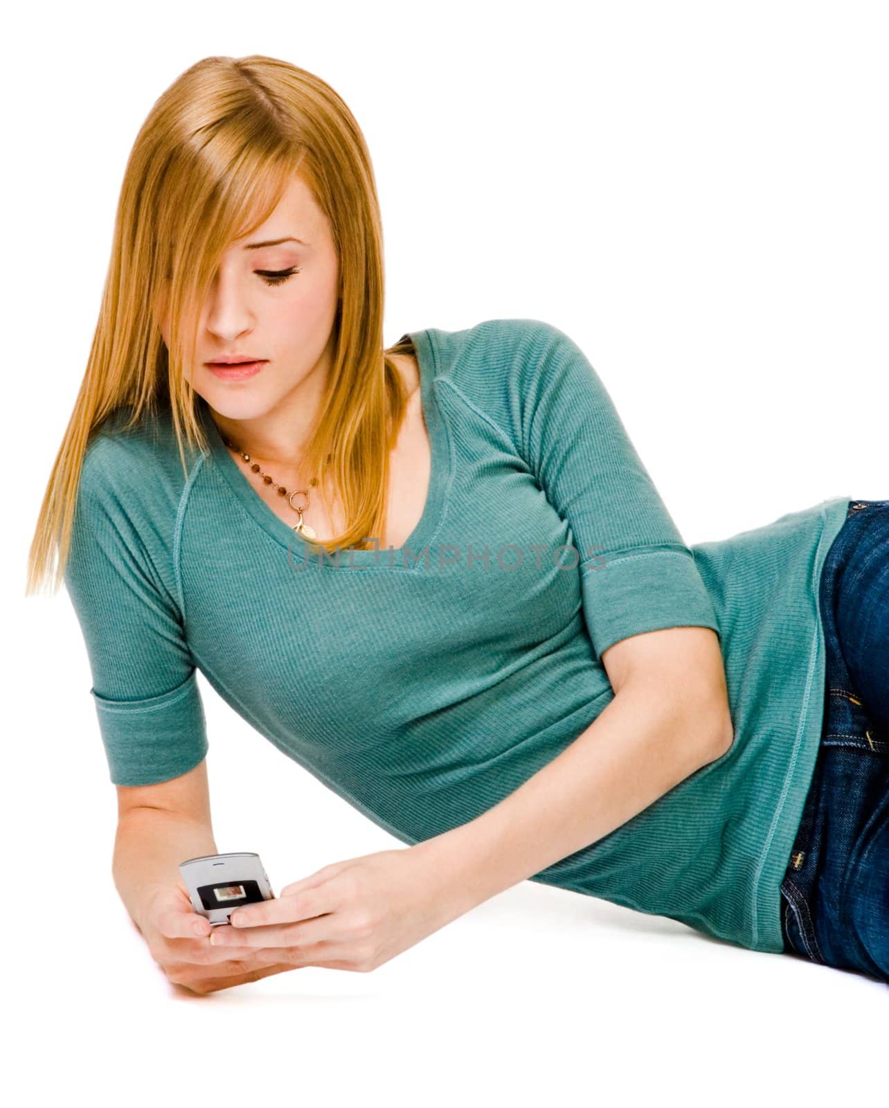 Close-up of a woman text messaging on a mobile phone isolated over white