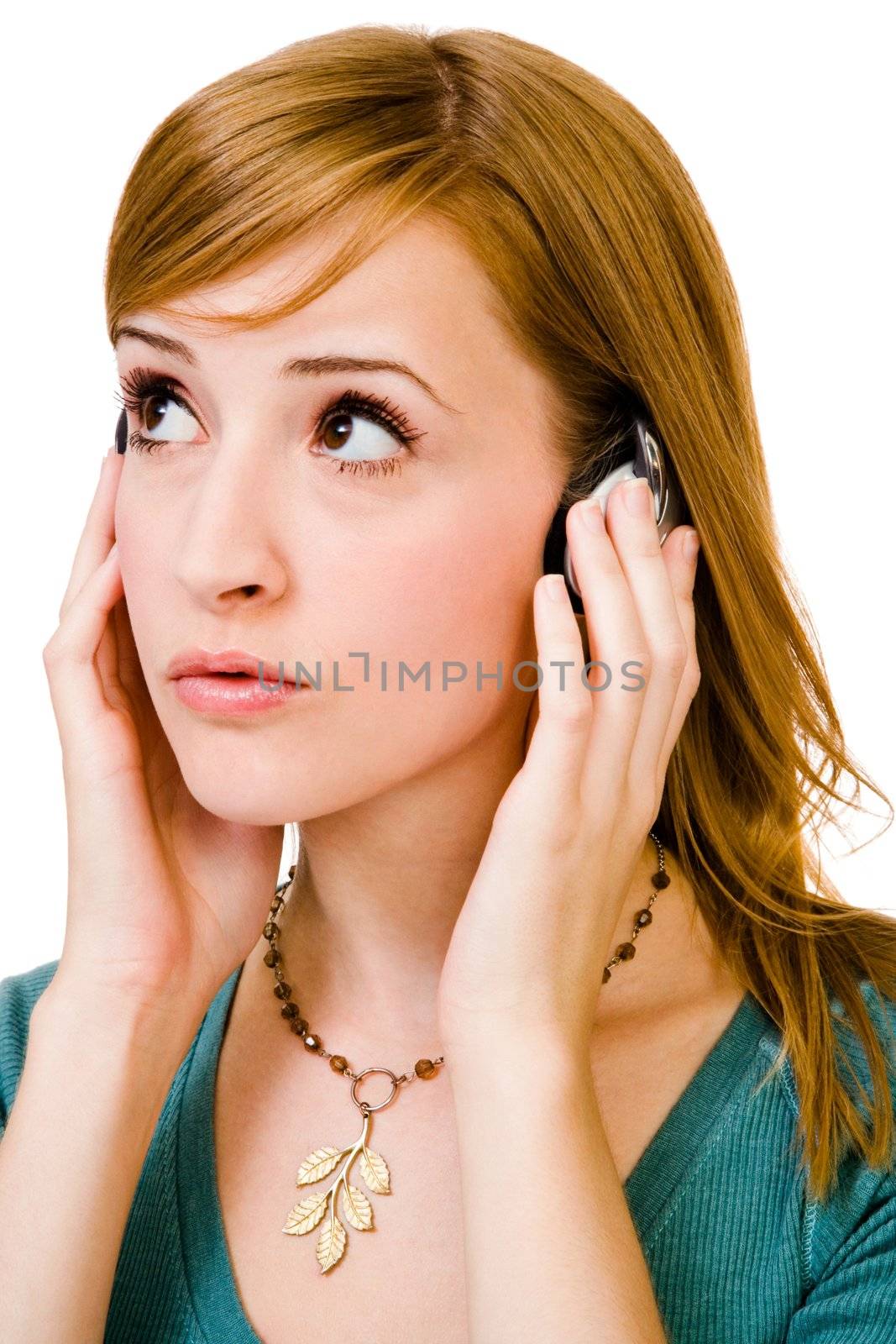 Beautiful woman wearing headphones and listening to music isolated over white