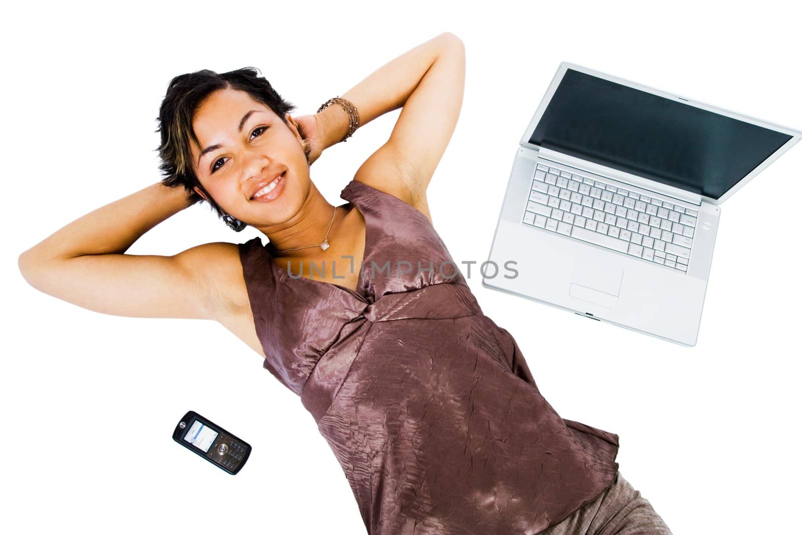 Fashion model lying near a laptop isolated over white