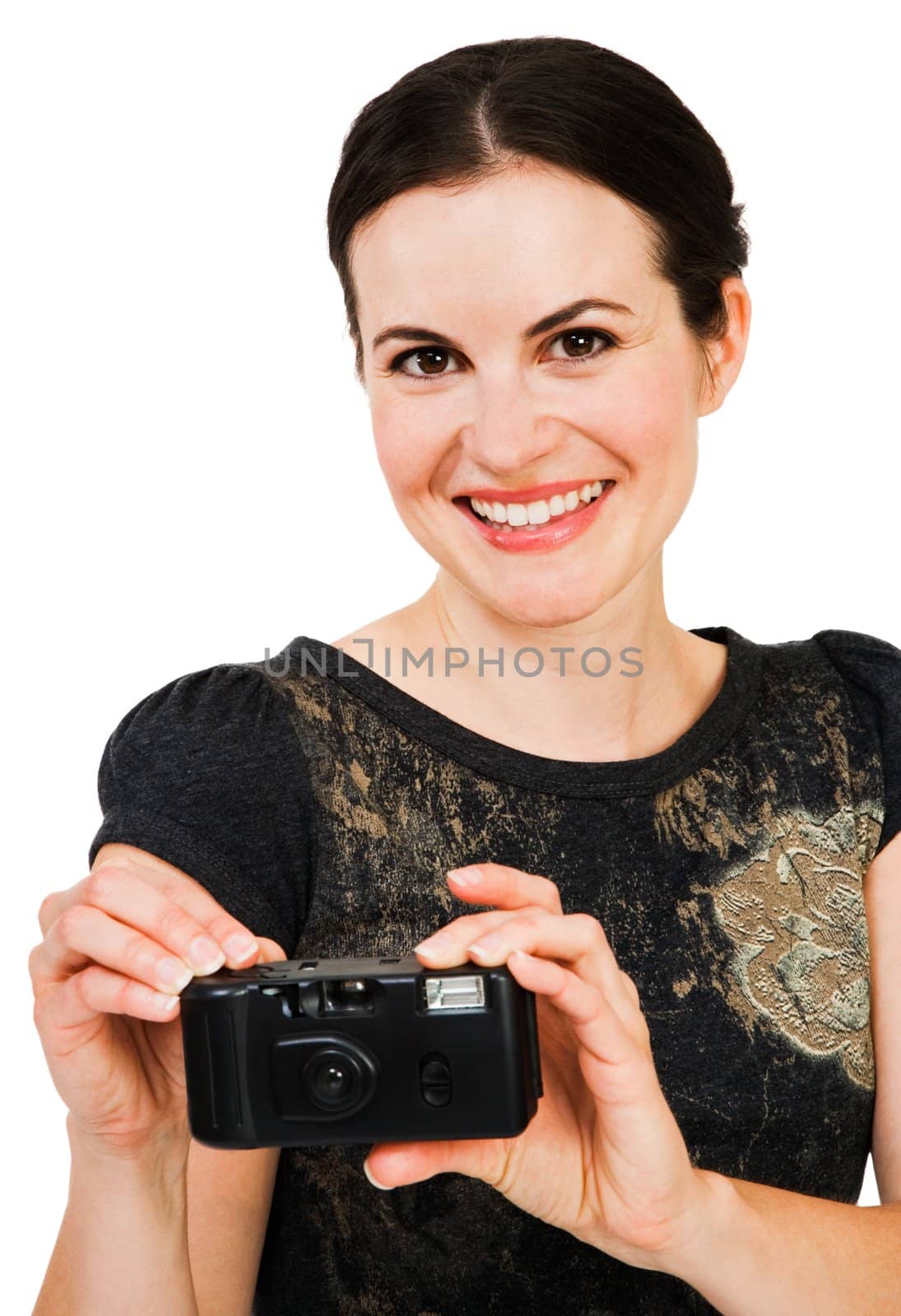 Happy young woman holding a camera isolated over white