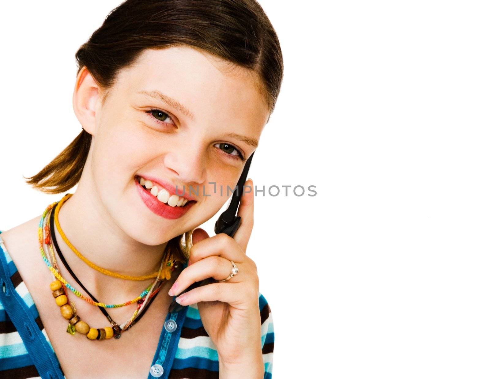 Portrait of a girl talking on a mobile phone isolated over white