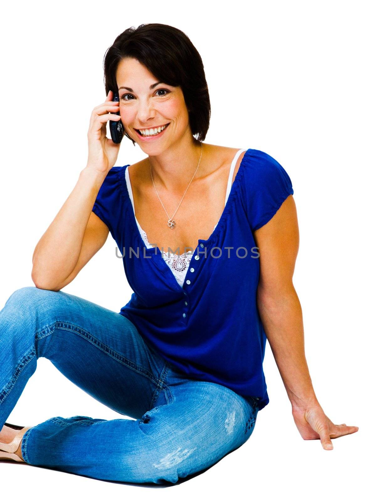 Happy woman talking on a mobile phone isolated over white