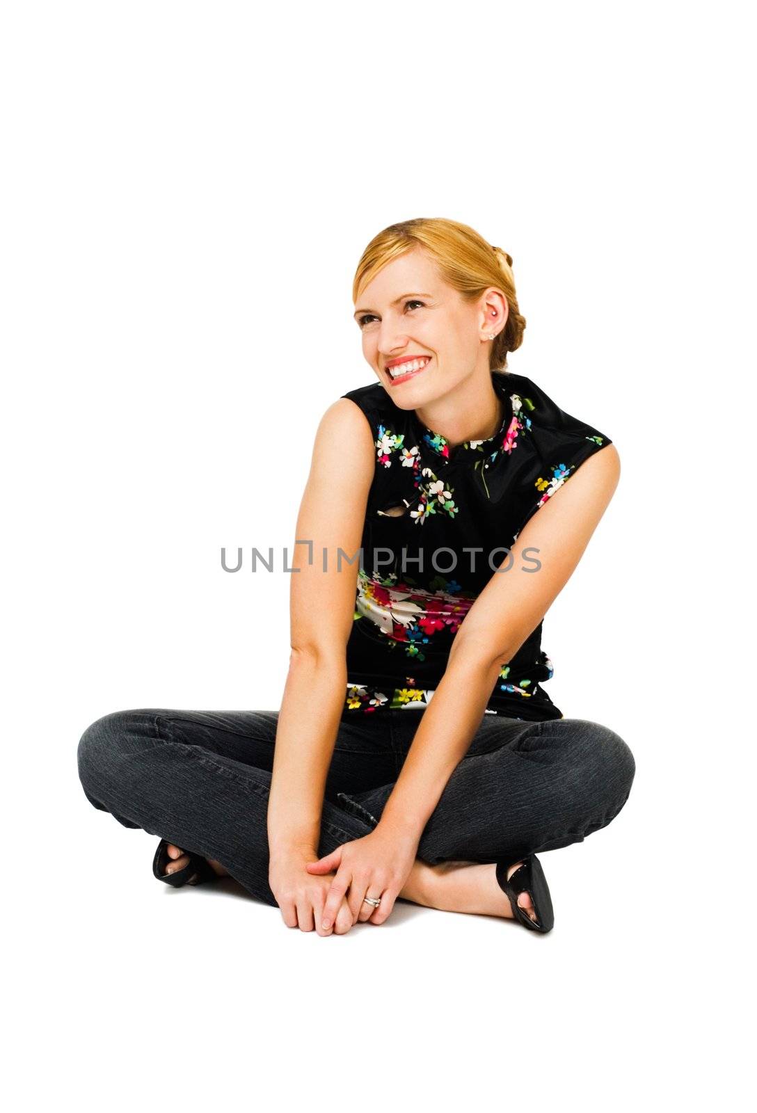 Confident young woman day dreaming and smiling isolated over white