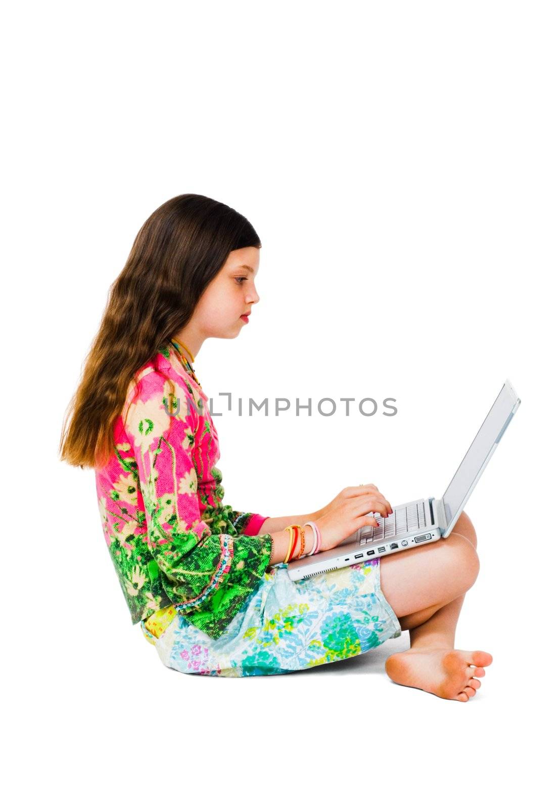 Beautiful girl working on a laptop isolated over white