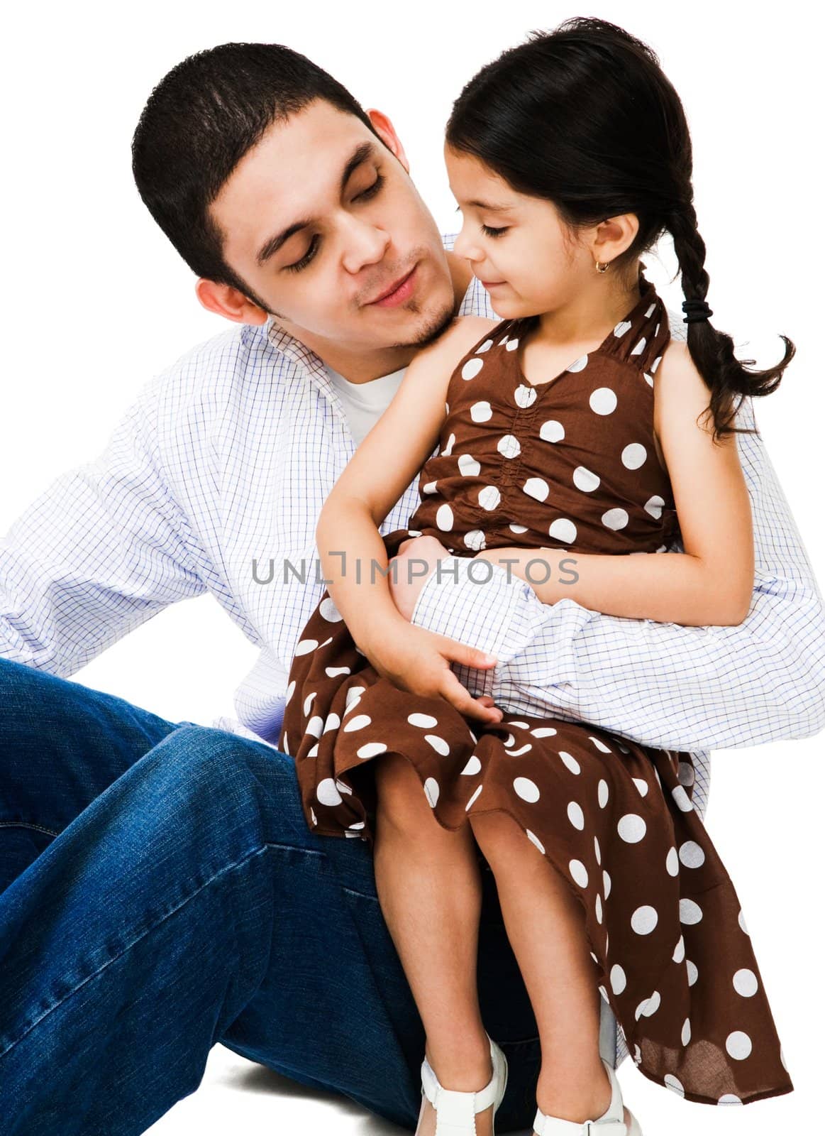 Close-up of a man hugging a girl isolated over white