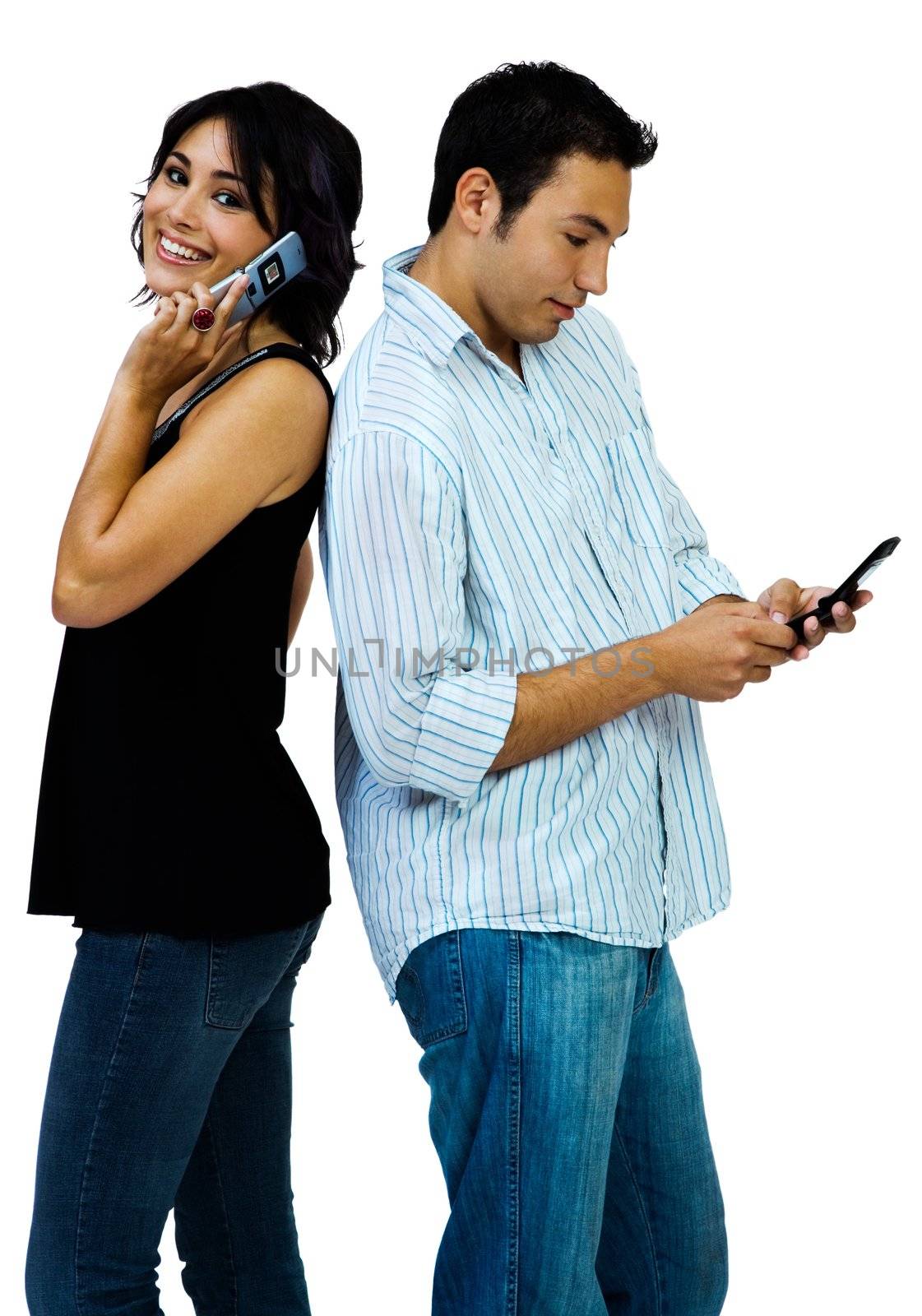 Portrait of couple using mobiles by jackmicro