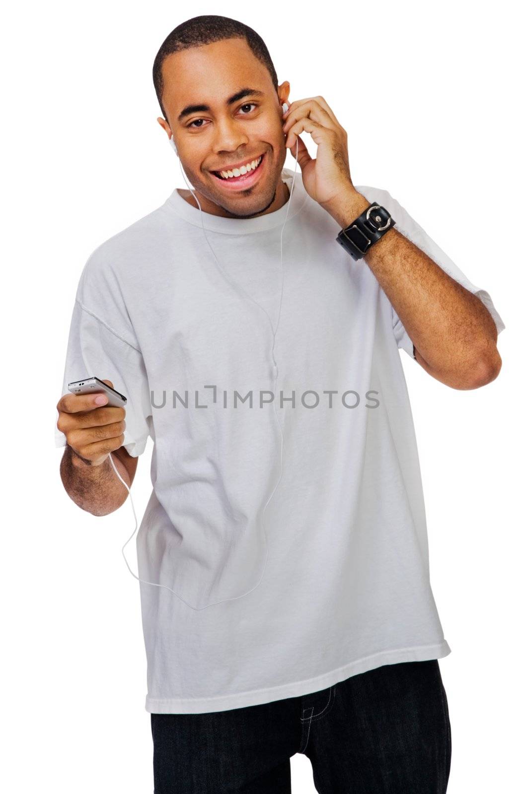 Portrait of a man listening to music on a MP3 player isolated over white