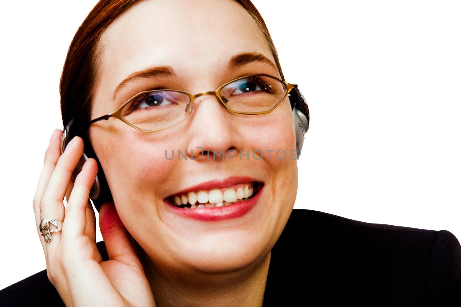 Young businesswoman listening to music on a headphones isolated over white
