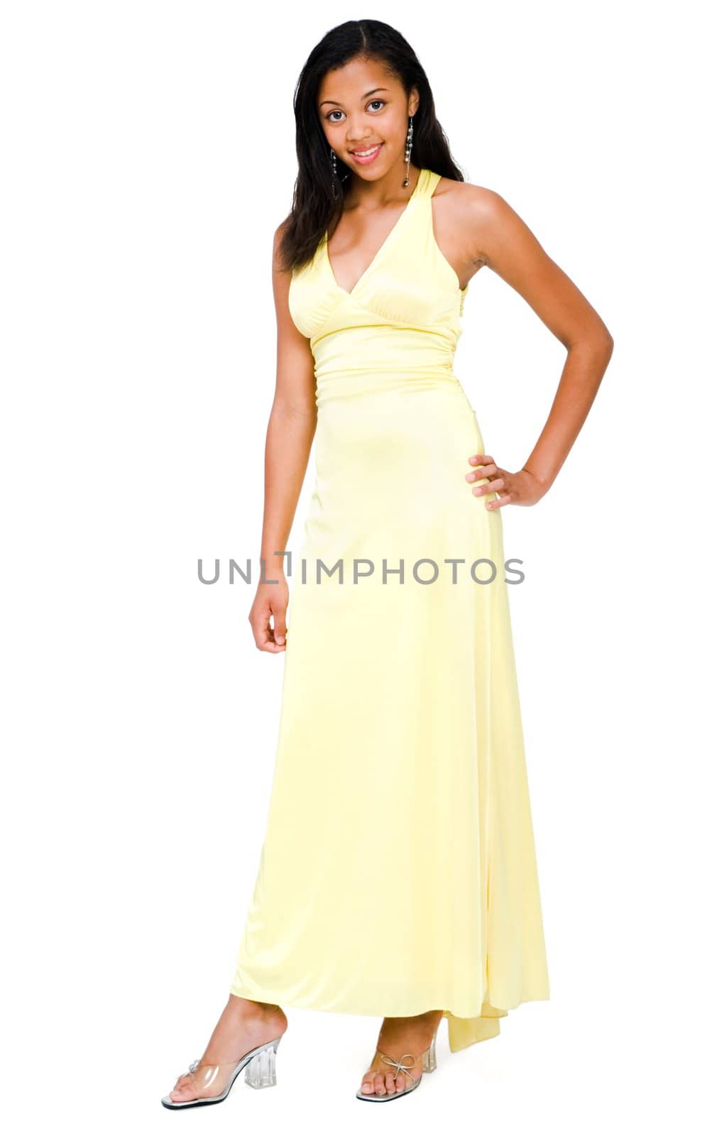 Portrait of a teenage girl standing isolated over white