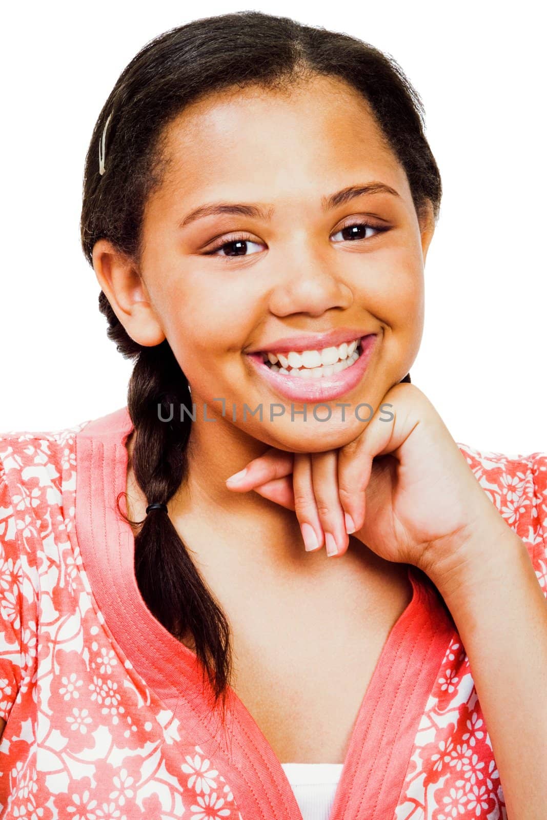 Teenage girl smiling with her hand on chin isolated over white