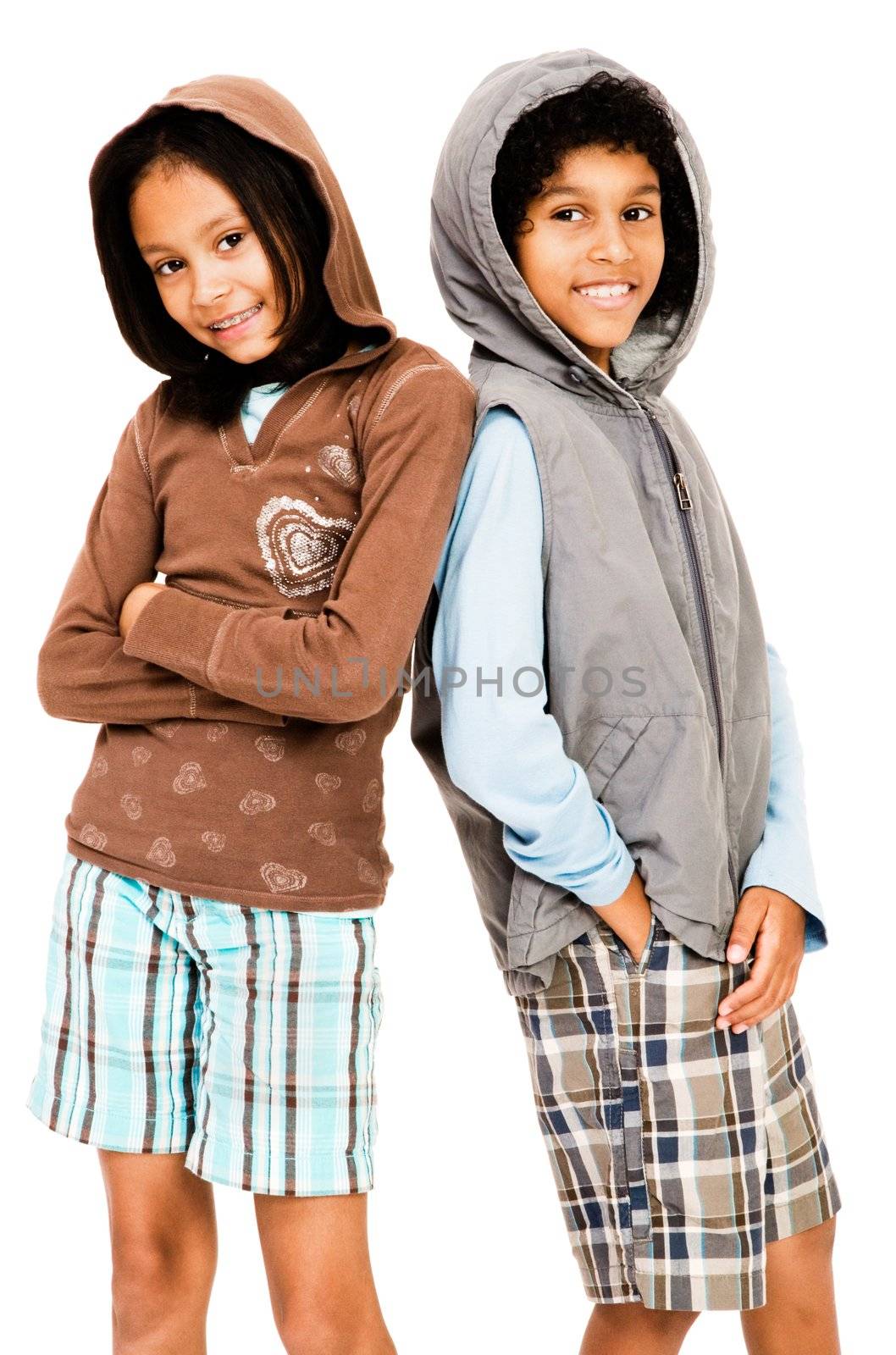 Portrait of two children standing together and smiling isolated over white