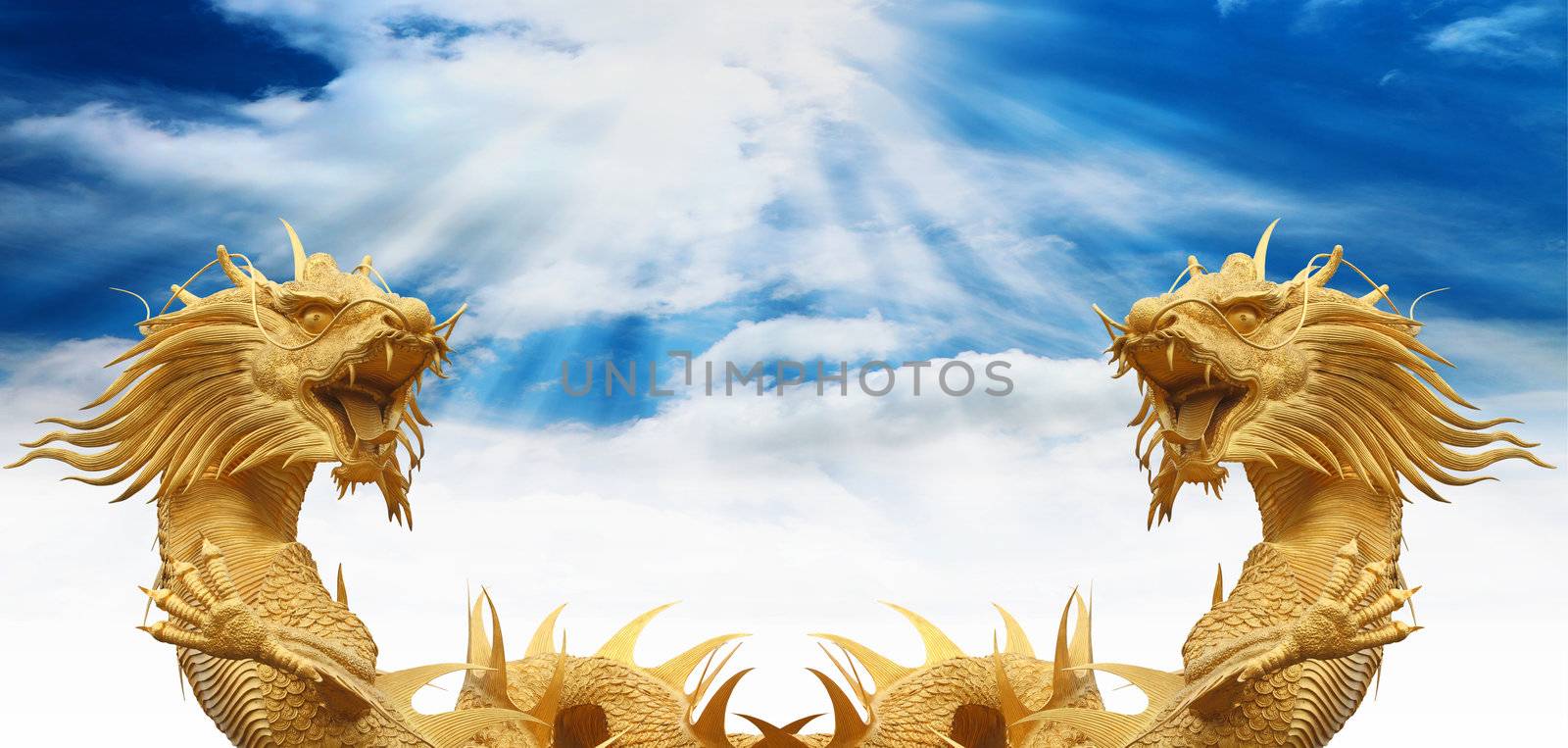 Chinese dragons statue with cloud and blue sky